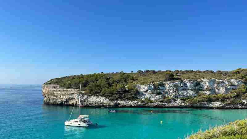 Idyllic Mediterranean bay with turquoise waters and a sailboat in Ibiza, Spain., tags: een saint george's, - pexel